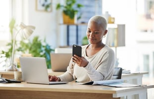 Person at desk on phone