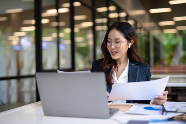 Person working at desk on computer