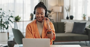 woman taking call on her computer