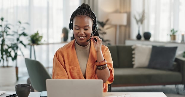 woman taking call on her computer