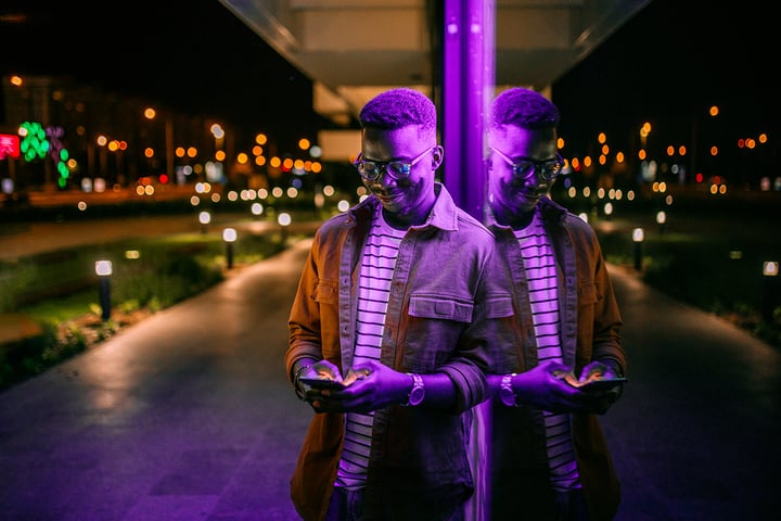 Man using mobile phone in evening