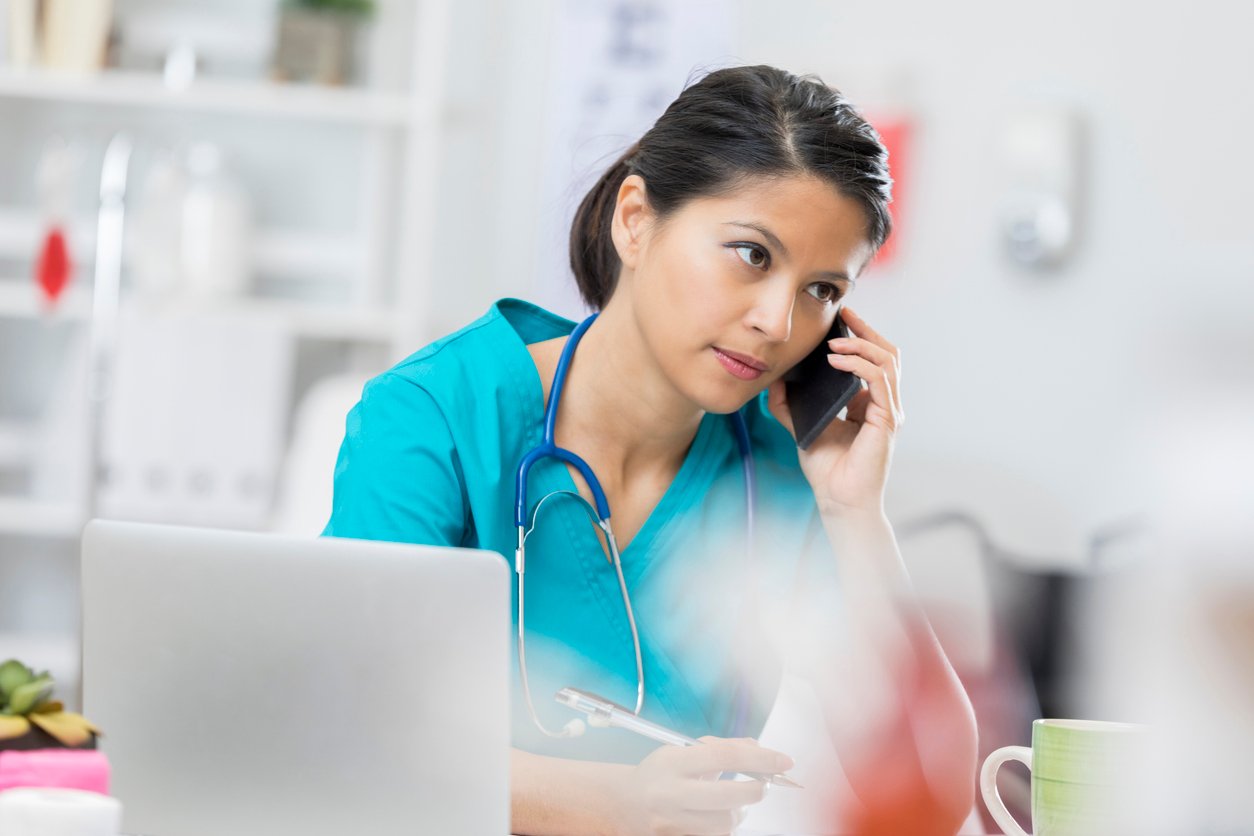 healthcare professional on mobile phone