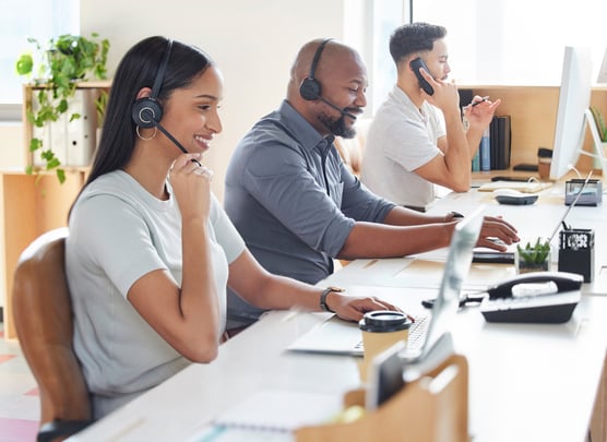 Group of people working together at computers