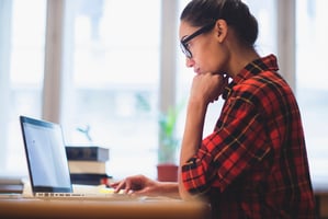 Woman listening to online event